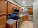 Modern kitchen featuring stainless steel appliances and stone backsplash at 8787 E Mountain View Rd # 1123, Scottsdale, AZ 85258