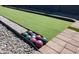 Outdoor bocce ball court with green turf and seating at 1513 E Sheridan St, Phoenix, AZ 85006