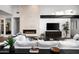 Living room with a modern fireplace, large TV, and plenty of seating at 6201 E Calle Redonda --, Scottsdale, AZ 85251