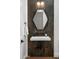 Stylish powder room featuring a floating vanity, dark tile, and a unique mirror at 6201 E Calle Redonda --, Scottsdale, AZ 85251