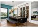 Elegant dining room features a large table, wine storage, and modern chandelier at 6201 E Calle Redonda --, Scottsdale, AZ 85251