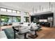 Open living area with a comfortable sectional sofa and large windows at 6201 E Calle Redonda --, Scottsdale, AZ 85251