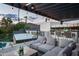 Relaxing rooftop deck with city views, comfortable seating, and string lights at 6201 E Calle Redonda --, Scottsdale, AZ 85251