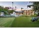Expansive backyard oasis with a pool, outdoor kitchen, and artificial turf at 6201 E Calle Redonda --, Scottsdale, AZ 85251