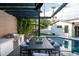 Outdoor kitchen, dining area, and pool with pergola at 6201 E Calle Redonda --, Scottsdale, AZ 85251