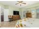 Bedroom with king bed, dresser and a view to the bathroom at 22625 N Las Vegas Dr, Sun City West, AZ 85375