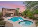 Inviting pool and spa surrounded by a desert landscape with a pergola at 32029 N 20Th Ln, Phoenix, AZ 85085