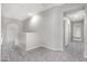 Upstairs hallway with gray carpet and access to other rooms at 32029 N 20Th Ln, Phoenix, AZ 85085