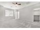 Spacious bedroom with ceiling fan and large window at 32029 N 20Th Ln, Phoenix, AZ 85085
