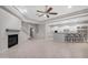 Open living room with a fireplace and kitchen views at 32029 N 20Th Ln, Phoenix, AZ 85085