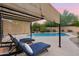 Relaxing poolside view with lounge chairs under a shaded pergola at 32029 N 20Th Ln, Phoenix, AZ 85085