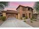 Two-story home with a covered carport and landscaping at 32029 N 20Th Ln, Phoenix, AZ 85085