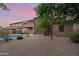 Landscaped backyard featuring a large pool and pebble-covered ground at 32029 N 20Th Ln, Phoenix, AZ 85085