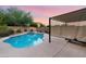 Stunning pool and spa surrounded by a beautifully landscaped backyard at 32029 N 20Th Ln, Phoenix, AZ 85085
