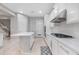 Bright kitchen featuring white cabinets and stainless steel appliances at 32029 N 20Th Ln, Phoenix, AZ 85085