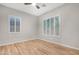 Spacious bedroom with wood-look floors and window shutters at 32029 N 20Th Ln, Phoenix, AZ 85085
