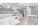 Modern kitchen with white cabinets and a large island at 32029 N 20Th Ln, Phoenix, AZ 85085