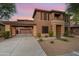 Two-story home with covered entryway and desert landscaping at 32029 N 20Th Ln, Phoenix, AZ 85085