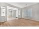 Light and airy living room with wood-look floors and a view to entryway at 32029 N 20Th Ln, Phoenix, AZ 85085