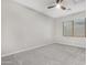 Simple bedroom with ceiling fan and window at 32029 N 20Th Ln, Phoenix, AZ 85085