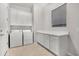 Laundry room with white cabinets and washer and dryer included at 32029 N 20Th Ln, Phoenix, AZ 85085