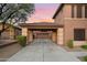 Two-story home with a covered carport and landscaping at 32029 N 20Th Ln, Phoenix, AZ 85085