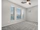 Bright bedroom with three windows and ceiling fan at 32029 N 20Th Ln, Phoenix, AZ 85085