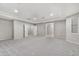 Bright bedroom with carpet flooring, and access to other rooms at 32029 N 20Th Ln, Phoenix, AZ 85085