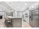 Open kitchen with an island and stainless steel appliances at 32029 N 20Th Ln, Phoenix, AZ 85085