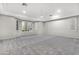Spacious primary bedroom with carpeting, neutral walls, and plantation shutters at 32029 N 20Th Ln, Phoenix, AZ 85085