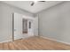 Bedroom with wood-look floors and access to another room at 32029 N 20Th Ln, Phoenix, AZ 85085