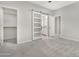 Bedroom with barn door leading to en-suite bathroom at 32029 N 20Th Ln, Phoenix, AZ 85085