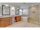 Elegant bathroom with double vanity, granite countertops, and a shower at 3210 N 108Th Ln, Avondale, AZ 85392