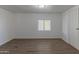 Spacious bedroom with vinyl plank flooring and large window at 2650 W Union Hills Dr # 236, Phoenix, AZ 85027