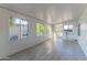 Bright sunroom with tile flooring and access to the backyard at 2650 W Union Hills Dr # 236, Phoenix, AZ 85027