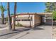 Front view of a manufactured home with carport, landscaping, and storage shed at 2650 W Union Hills Dr # 236, Phoenix, AZ 85027