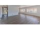 Bright living room with vinyl plank flooring and neutral walls at 2650 W Union Hills Dr # 236, Phoenix, AZ 85027