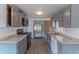 Modern kitchen with gray cabinets, granite countertops, and stainless steel appliances at 2650 W Union Hills Dr # 236, Phoenix, AZ 85027