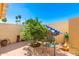 Landscaped backyard with a lemon tree and stone accents at 13467 W Desert Glen Dr, Sun City West, AZ 85375