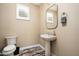 Small powder room with pedestal sink and modern fixtures at 36495 N Livorno Way, Scottsdale, AZ 85262