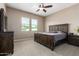 Spacious bedroom with a large bed and plenty of natural light at 42162 W Palmyra Ct, Maricopa, AZ 85138