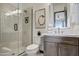 Modern bathroom with glass shower, gray vanity, and stylish tile at 19980 E El Nido Ln, Litchfield Park, AZ 85340