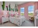 Charming bedroom with cactus wall art, a comfy bed, and plenty of natural light at 19980 E El Nido Ln, Litchfield Park, AZ 85340
