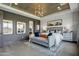 Elegant main bedroom with wood ceiling, and a cozy sitting area at 19980 E El Nido Ln, Litchfield Park, AZ 85340