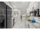 Modern kitchen with granite countertops, stainless steel appliances, and light-colored cabinets at 12311 W Tigerseye Dr, Sun City West, AZ 85375