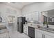 Modern kitchen with granite countertops and stainless steel appliances at 12311 W Tigerseye Dr, Sun City West, AZ 85375