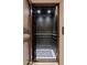 Modern elevator with dark wood and detailed flooring at 23036 N Via Ventosa Dr, Scottsdale, AZ 85255