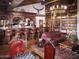 Home bar with extensive bookshelf and chessboard at 23036 N Via Ventosa Dr, Scottsdale, AZ 85255