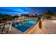 Inviting swimming pool with string lights and mountain views at 23036 N Via Ventosa Dr, Scottsdale, AZ 85255