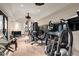 Well-equipped home gym featuring various exercise machines and weights at 23036 N Via Ventosa Dr, Scottsdale, AZ 85255